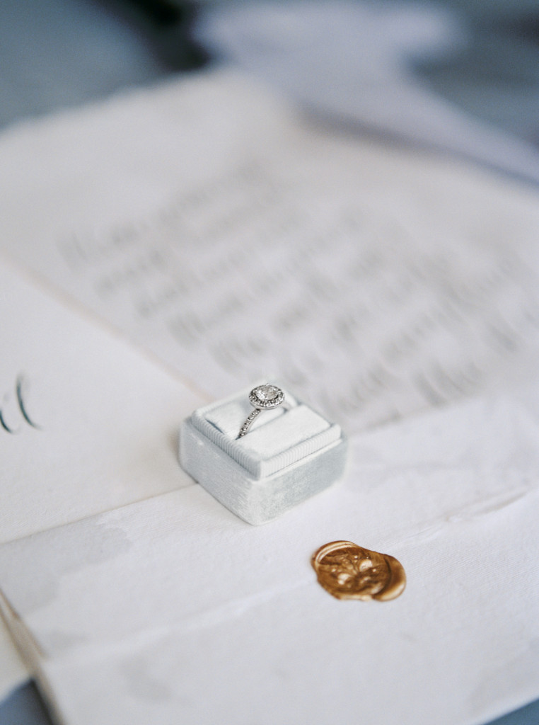 Romantic circle cut diamond ring in a Mrs Box on top of hand-written calligraphy vows from Spurle Gul Studio. Captured by Niagara wedding photographer www.kaylayestal.com