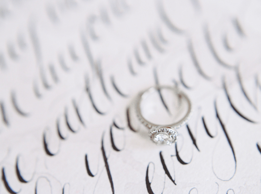 Romantic circle cut diamond ring on top of hand-written calligraphy vows from Spurle Gul Studio. Captured by Niagara wedding photographer www.kaylayestal.com