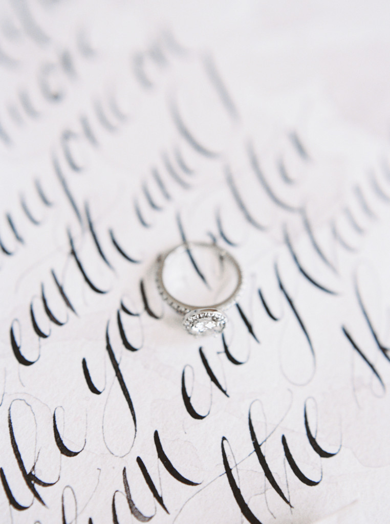 Romantic circle cut diamond ring on top of hand-written calligraphy vows from Spurle Gul Studio. Captured by Niagara wedding photographer www.kaylayestal.com