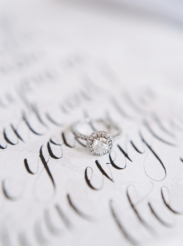 Romantic circle cut diamond ring on top of hand-written calligraphy vows by Spurle Gul Studio photographed by fine art wedding photographer Kayla Yestal. www.kaylayestal.com