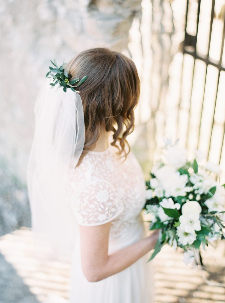 Bride wearing a Tatyana Merenyuk separate wedding gown with a Blooms and Flora loose green and white wedding bouquet and greenery hairpiece at Goldie Mill | Alton Mill Wedding | Goldie Mill Wedding | Caledon Wedding Photographer | Guelph Wedding Photographer | Kayla Yestal
