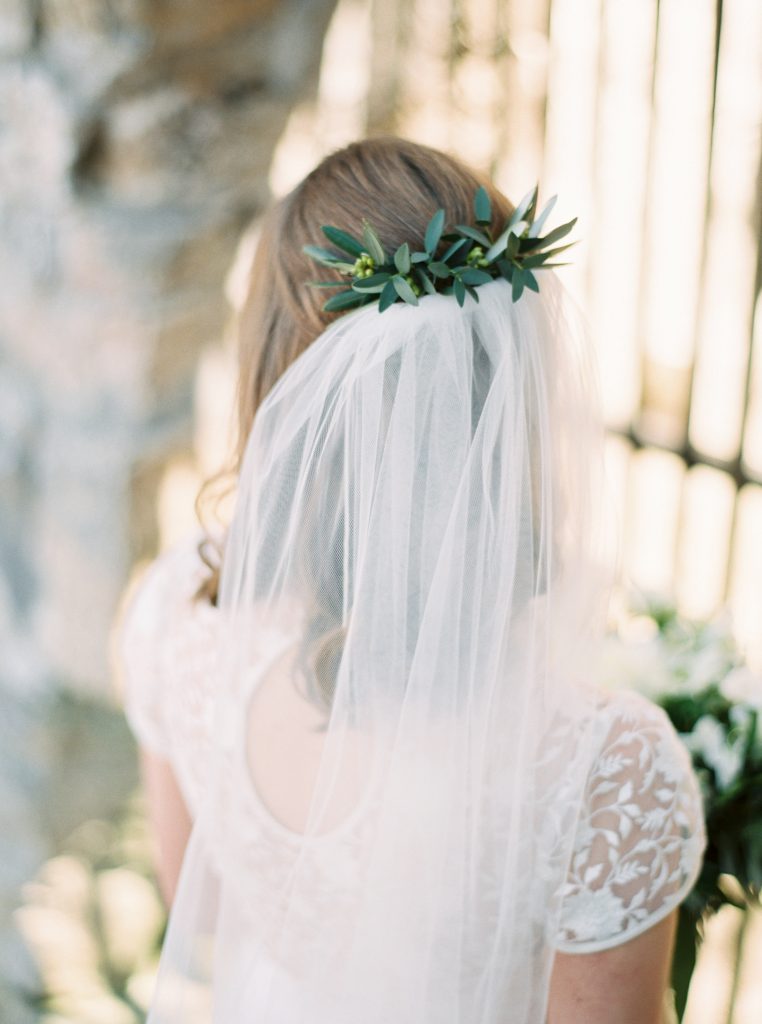 Bride wearing a Tatyana Merenyuk separate wedding gown with a Blooms and Flora loose green and white wedding bouquet and greenery hairpiece at Goldie Mill | Alton Mill Wedding | Goldie Mill Wedding | Caledon Wedding Photographer | Guelph Wedding Photographer | Kayla Yestal