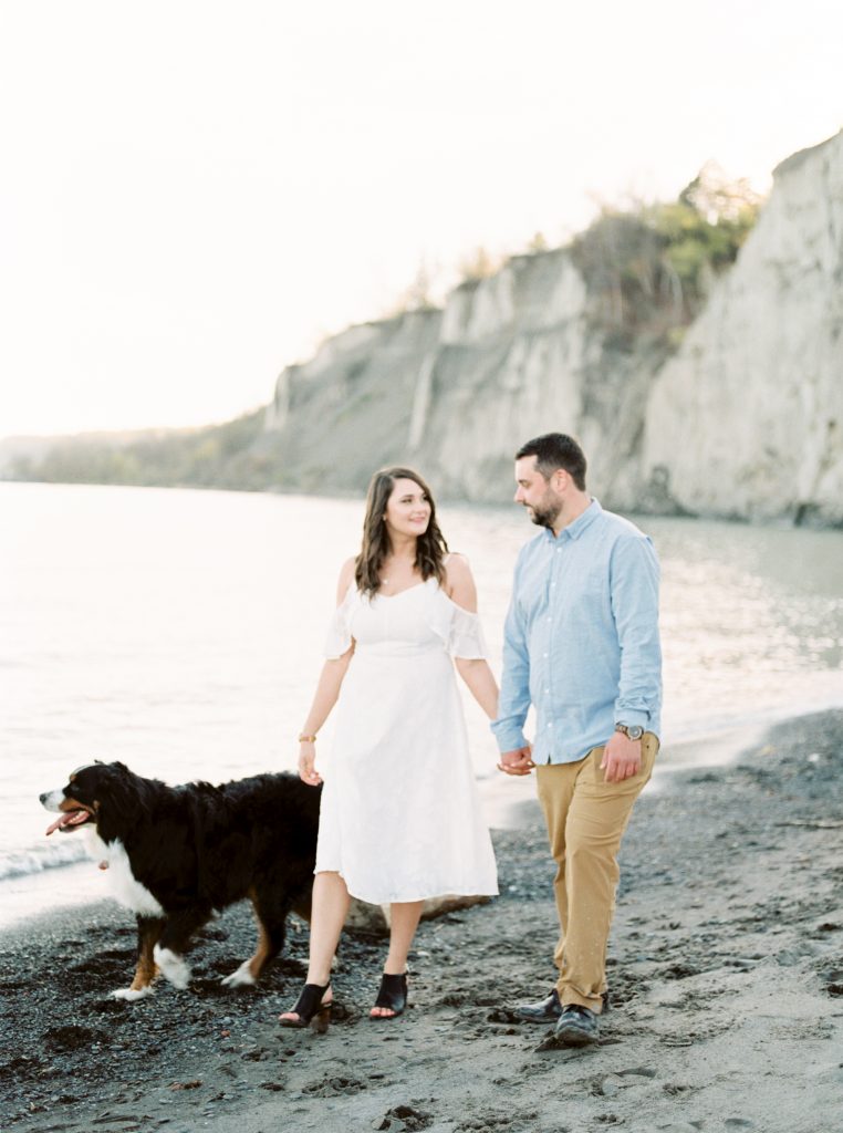 Katie and Justin's Scarborough Bluffs Engagement Session with Bernese Mountain Dog, Sadie | White off-shoulder lace dress engagement session | Kayla Yestal | Bernese Mountain Dog Puppy | Toronto Engagement Session | Toronto Wedding Photographer