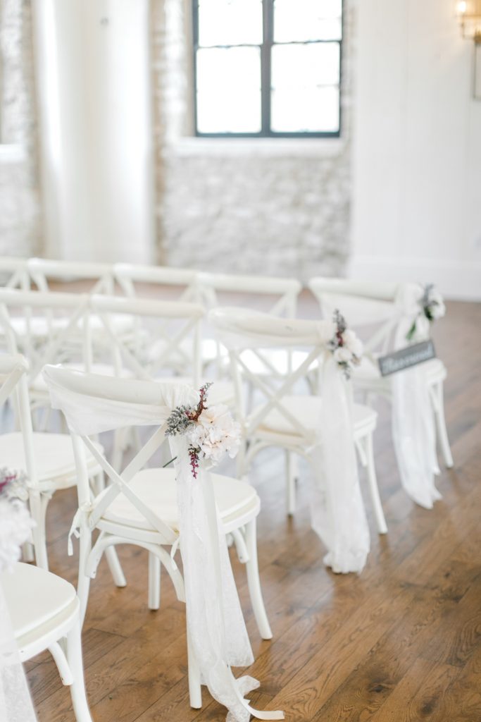 Elora Mill Wedding photographed by Elora wedding photographer Kayla Yestal | Ontario Fine Art Wedding Photographer | White Crossback Wedding Chairs | Elora Mill Chapel Wedding Foundry